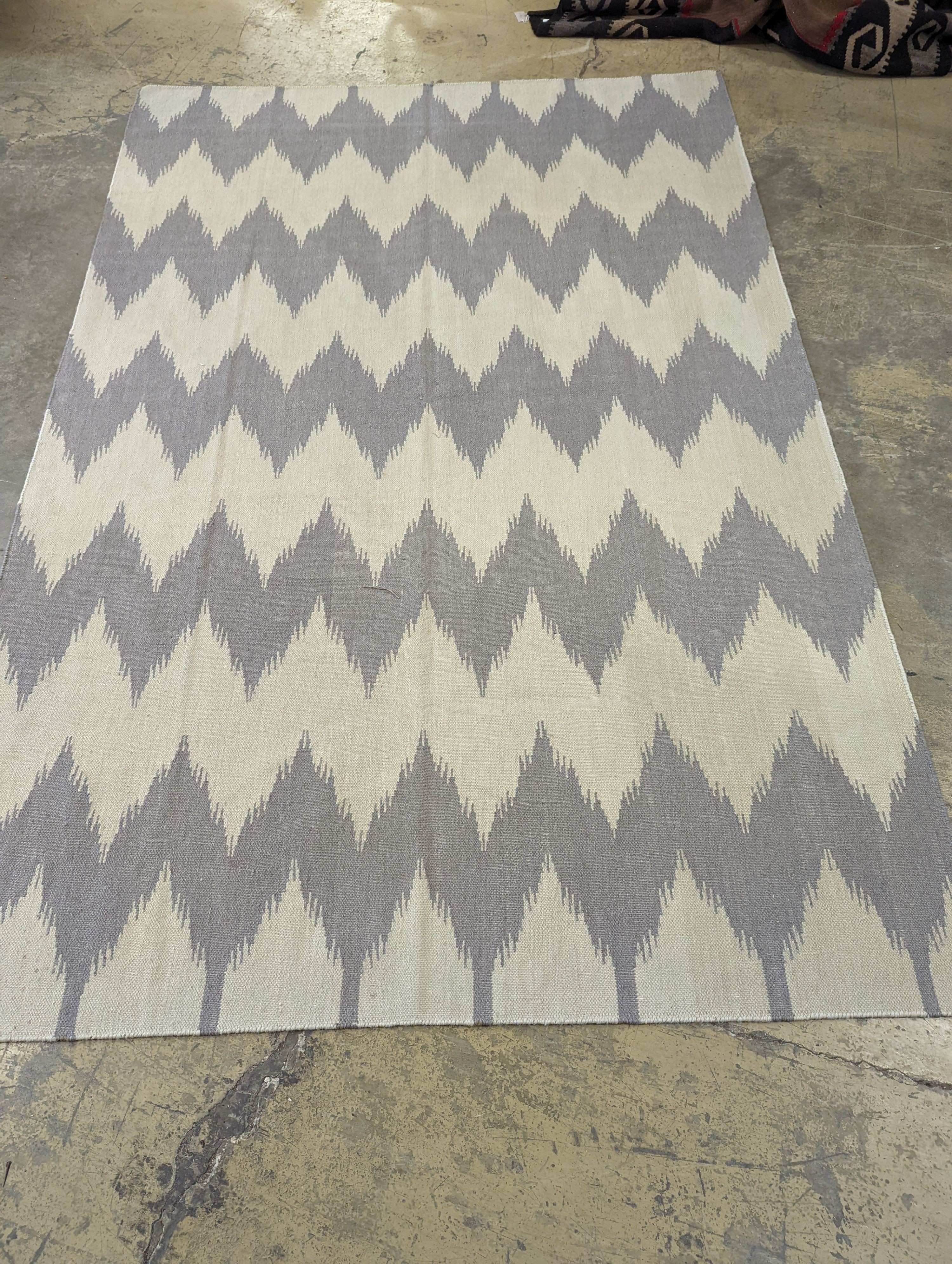 An Ikat contemporary dhurrie, approx. 200 x 160cm